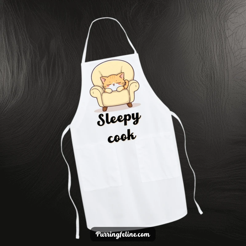 Funny apron showcasing a sleepy cat dozing off in a cozy armchair, adding humor and charm to kitchen activities.