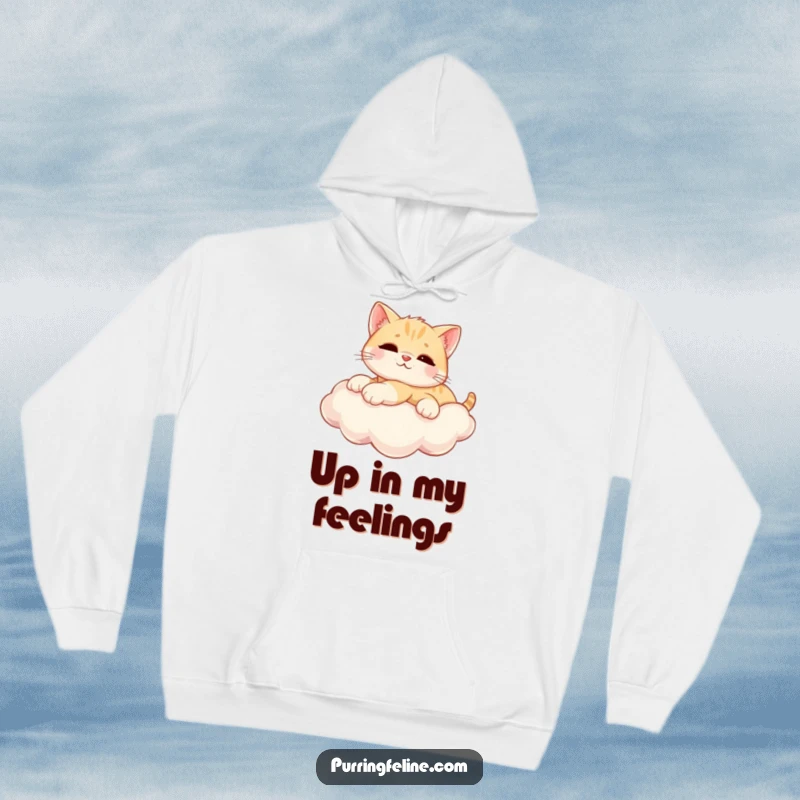 Funny Hoodie shows a relaxed cat cub stretched out on a sunny cloud, offering warmth and a feeling of blissful escape.
