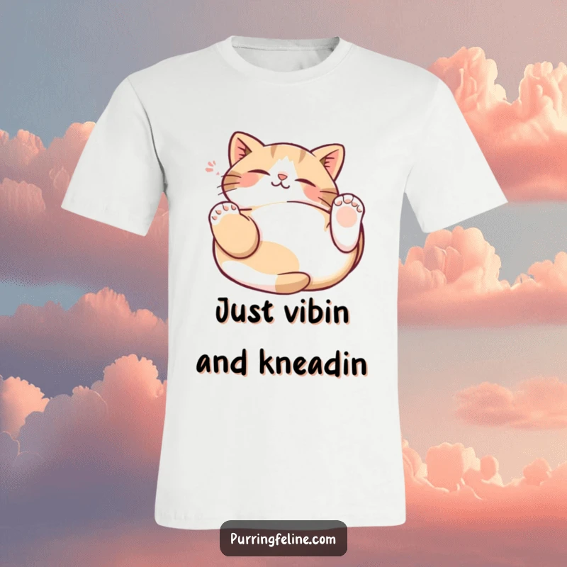 Funny Cat Kneading T-Shirt showing a relaxed cat on its back, paws rhythmically kneading the air with pure joy.