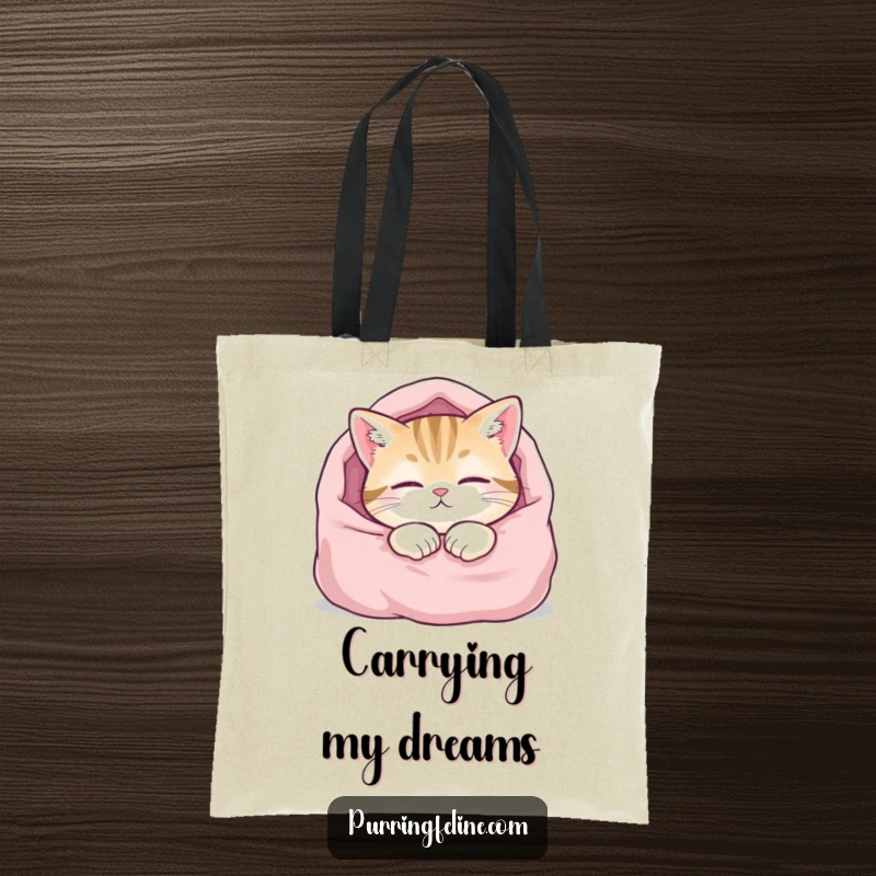 Funny tote bag with a content cat sleeping soundly in a blanket, ideal for carrying books or groceries with a touch of humor.